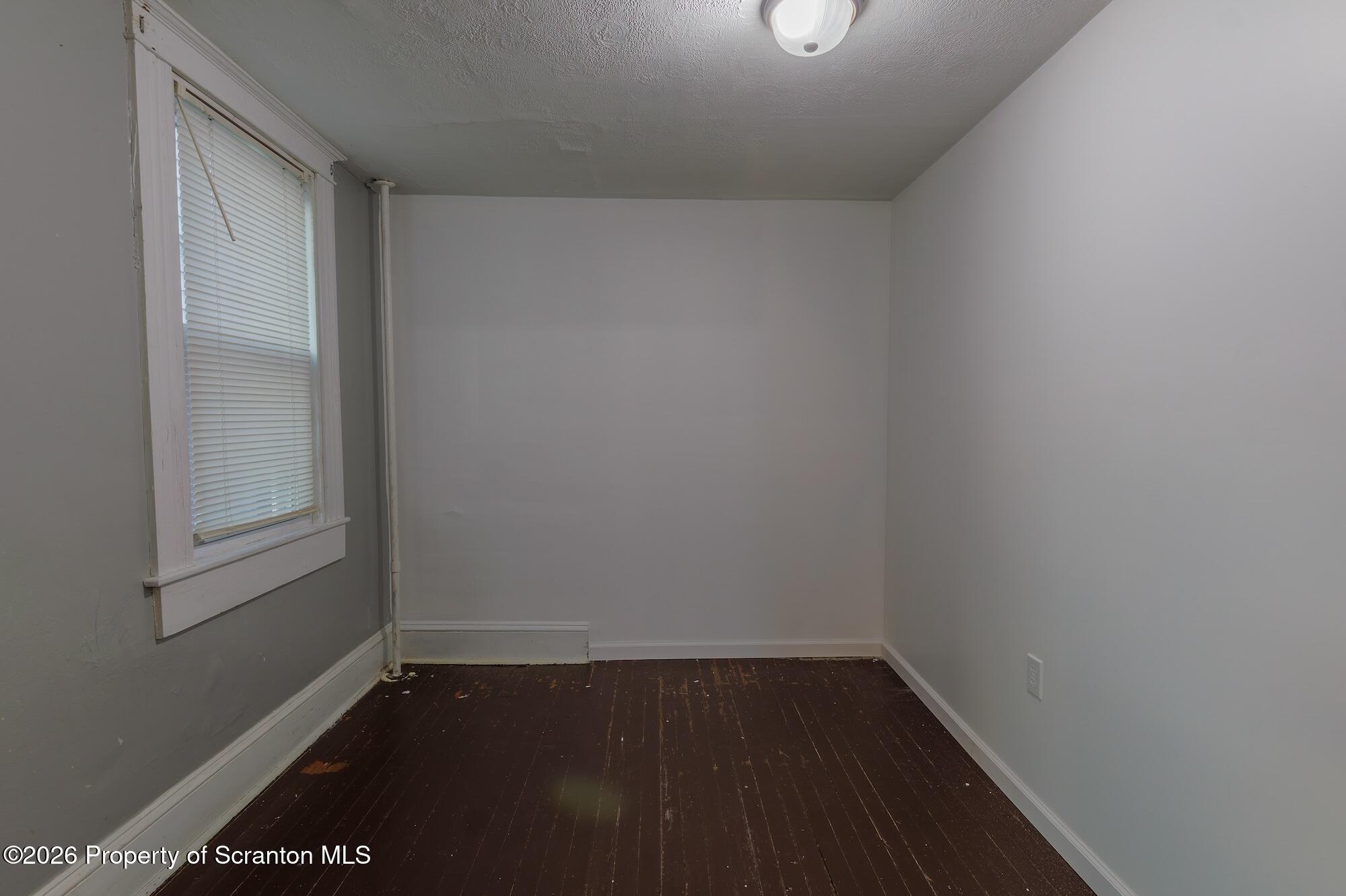 623 East Elm Street, Unit 1 Scranton, PA 18505 - Photo 5 of 15 a view of an empty room with wooden floor