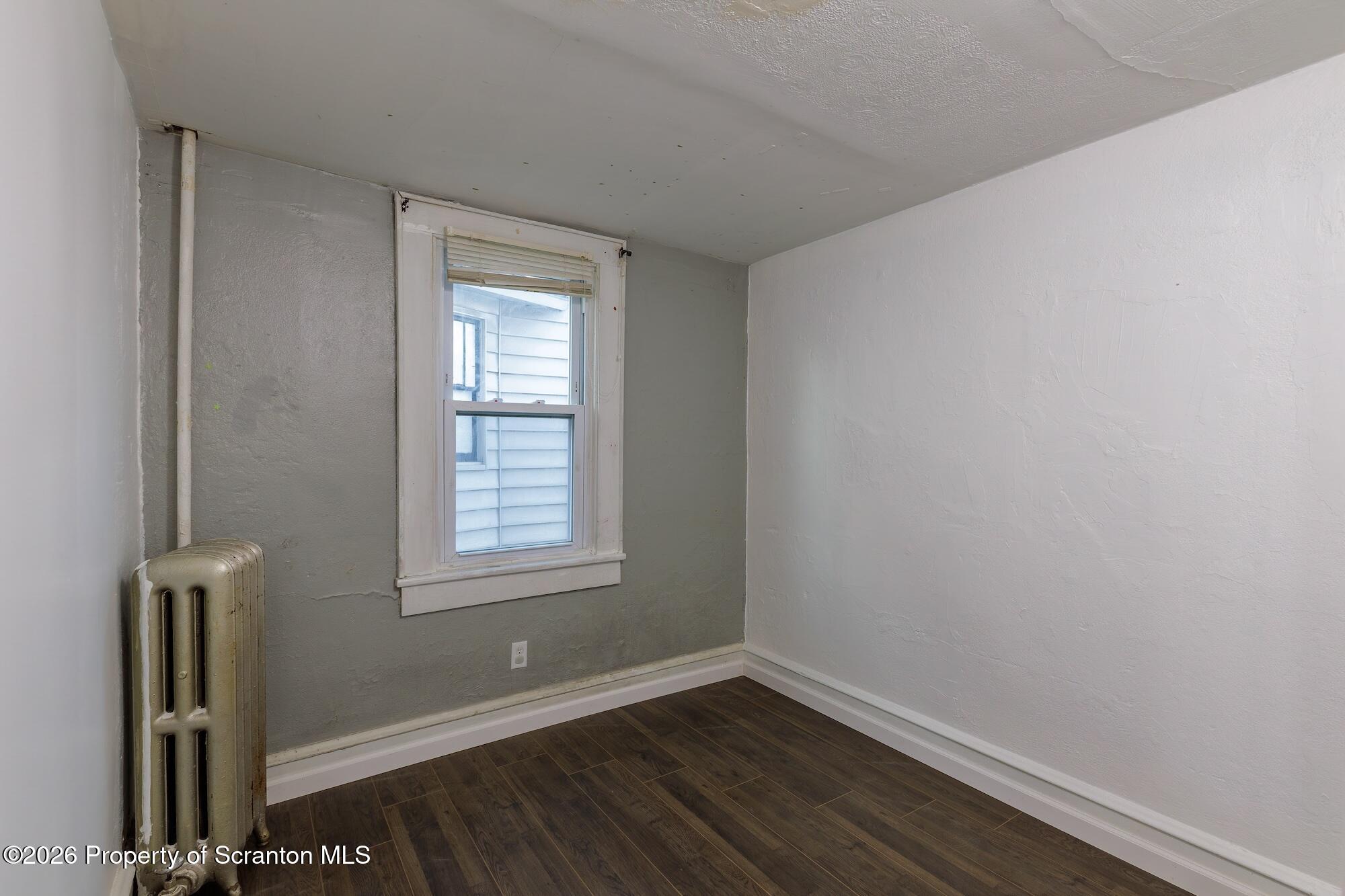 623 East Elm Street, Unit 1 Scranton, PA 18505 - Photo 6 of 15 a view of an empty room with wooden floor and a window