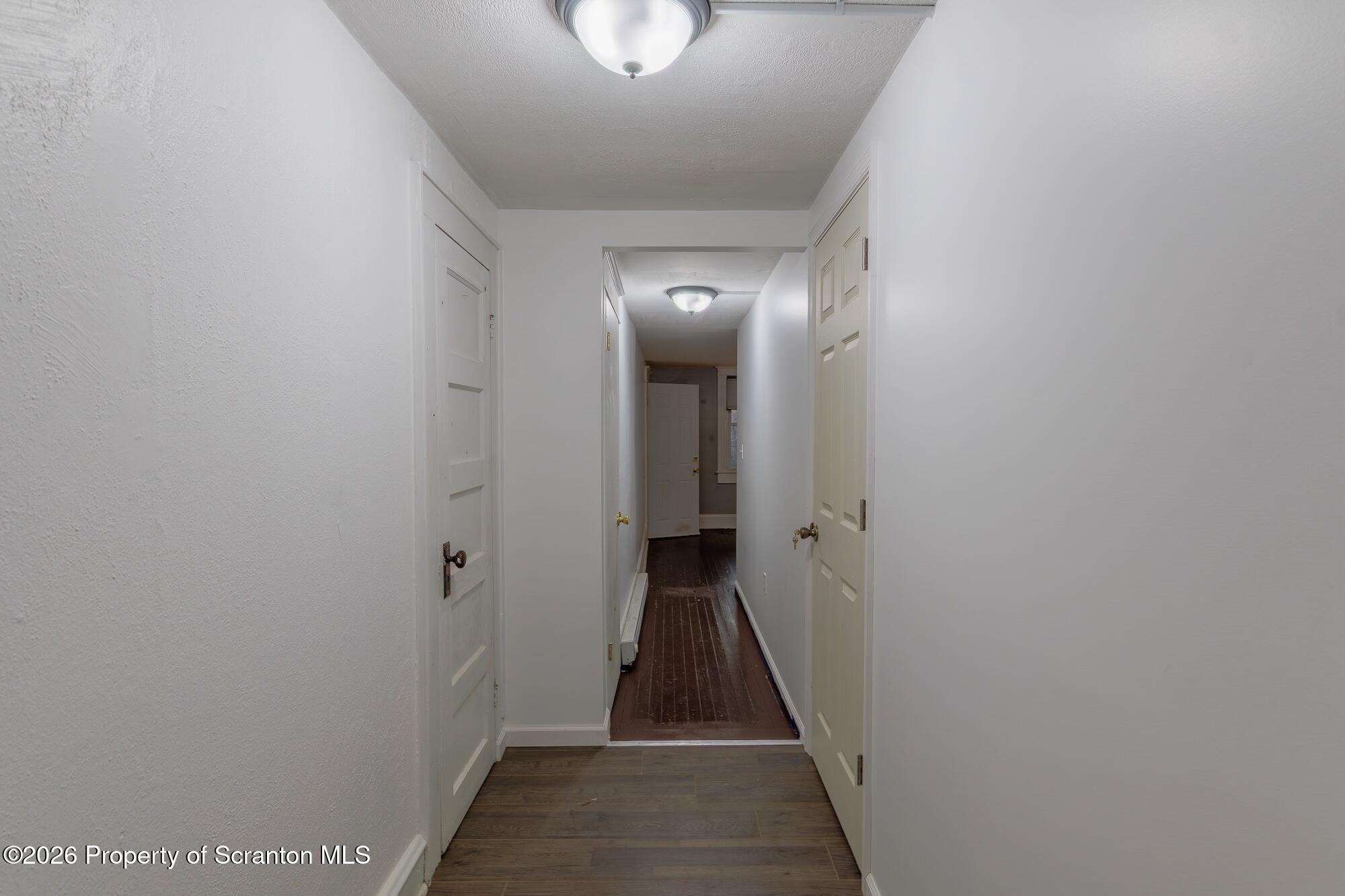 623 East Elm Street, Unit 1 Scranton, PA 18505 - Photo 7 of 15 a view of a hallway with a dining room