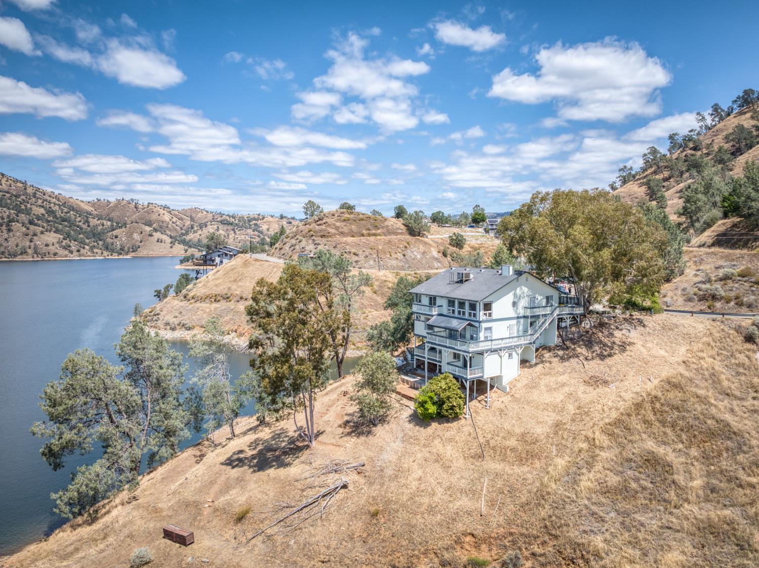 28037 Sky Harbour Road Friant, CA 93626 - Photo 1 of 40 a view of a lake with a mountain