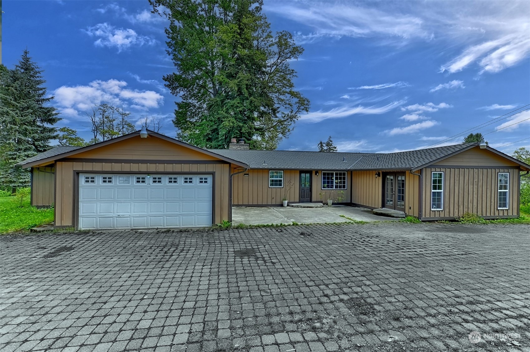 23720 Locust Way Bothell, WA 98021 - Photo 1 of 30 a front view of a house with a yard and garage