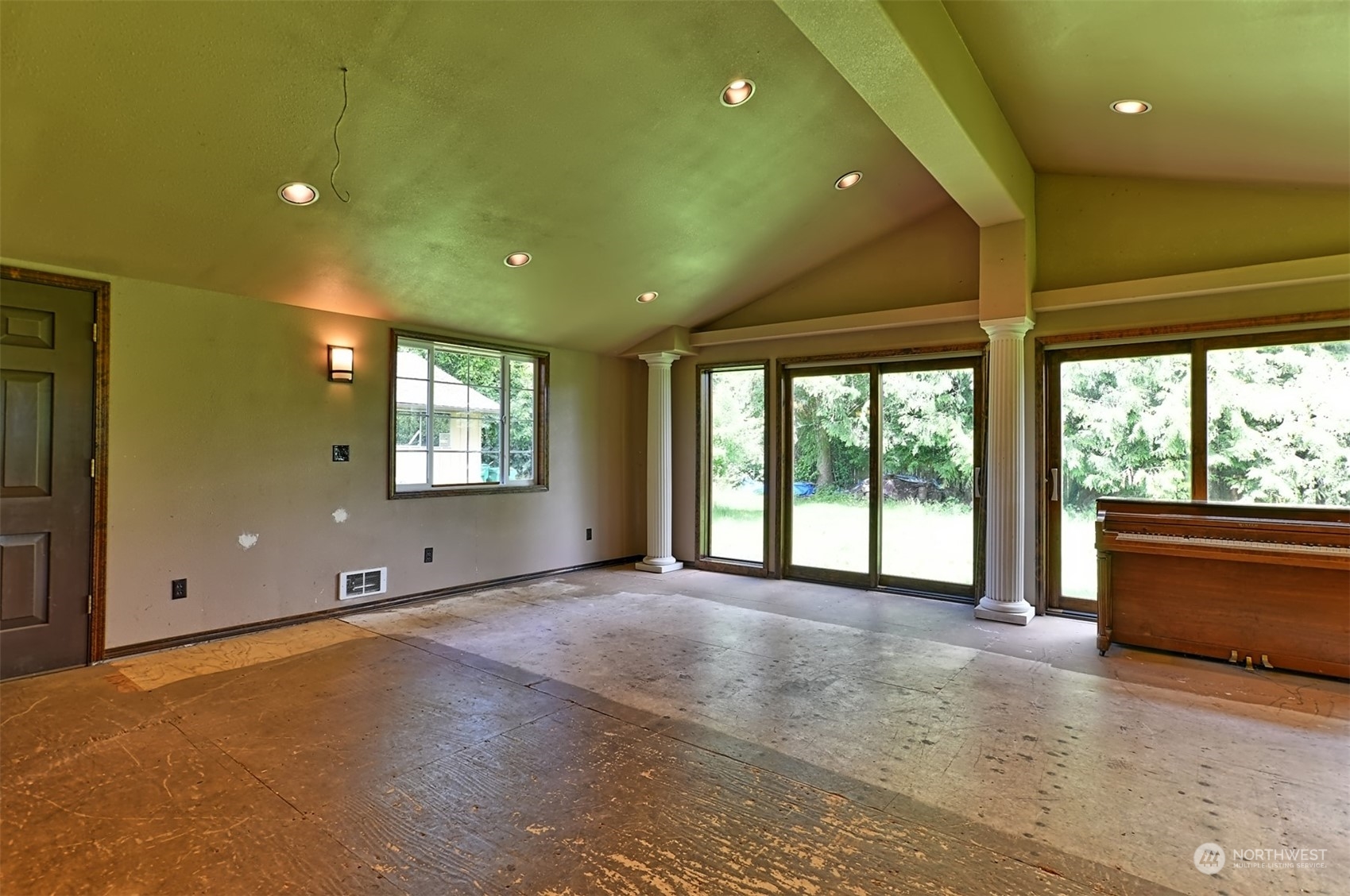 23720 Locust Way Bothell, WA 98021 - Photo 15 of 30 a view of an empty room with a fireplace and a large window