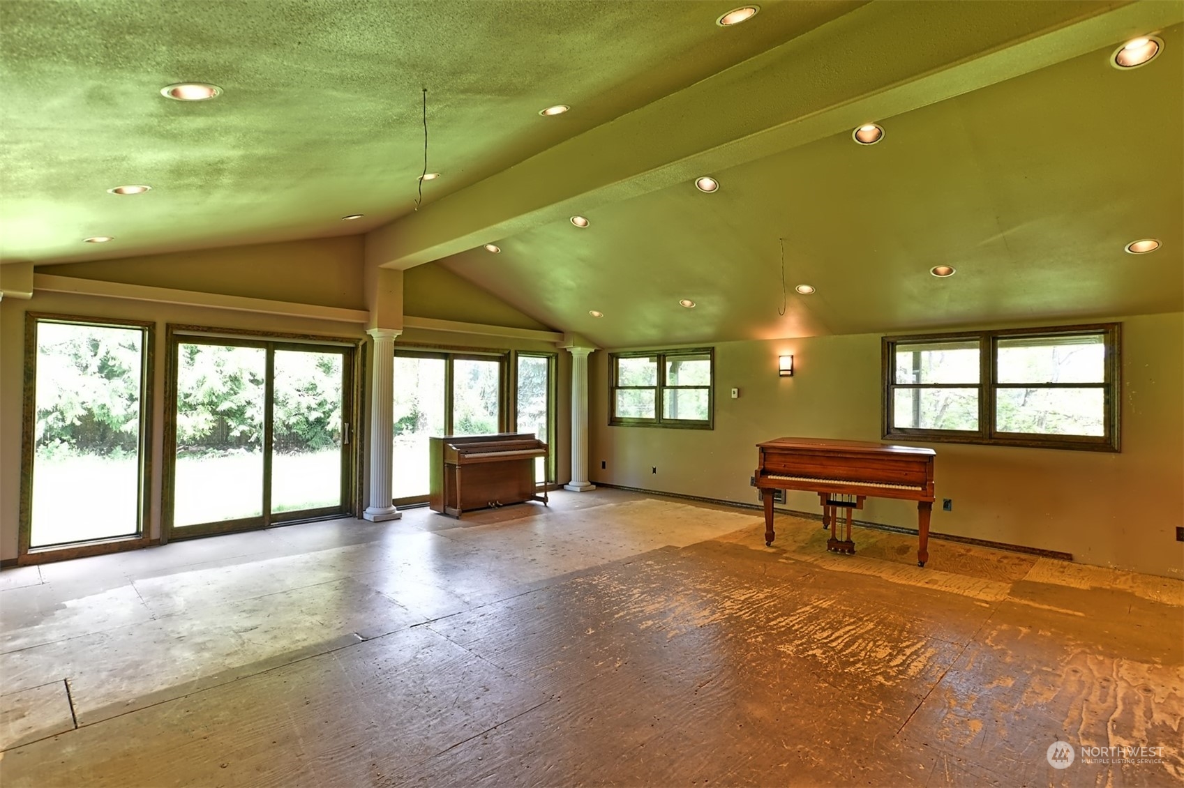 23720 Locust Way Bothell, WA 98021 - Photo 17 of 30 a view of an empty room with a fireplace and a large window