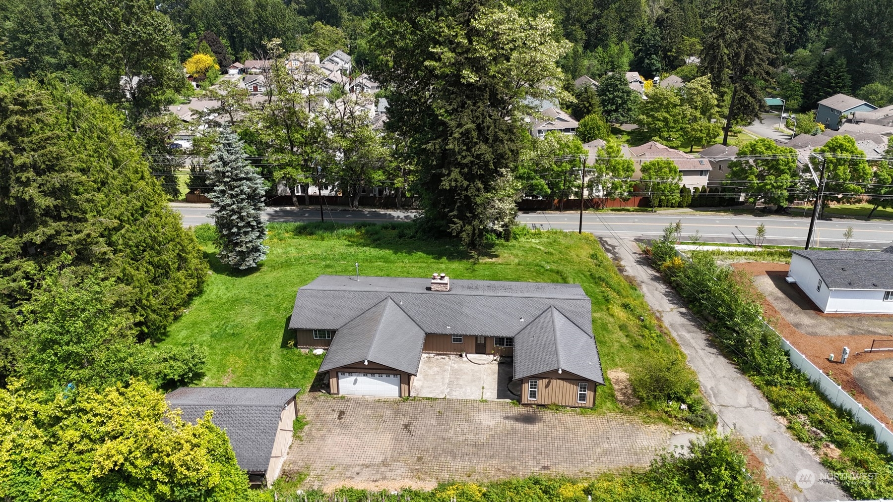 23720 Locust Way Bothell, WA 98021 - Photo 2 of 30 an aerial view of a house with garden space and sitting area