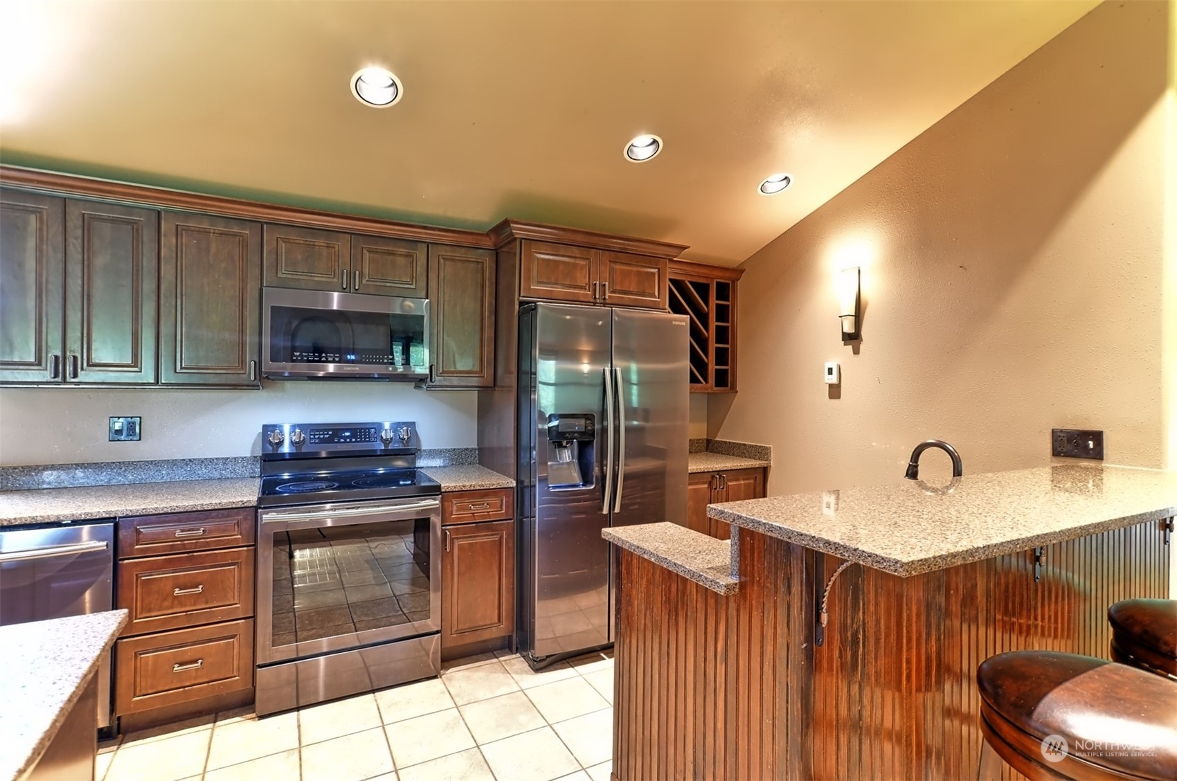 23720 Locust Way Bothell, WA 98021 - Photo 4 of 30 a kitchen with a sink appliances and cabinets