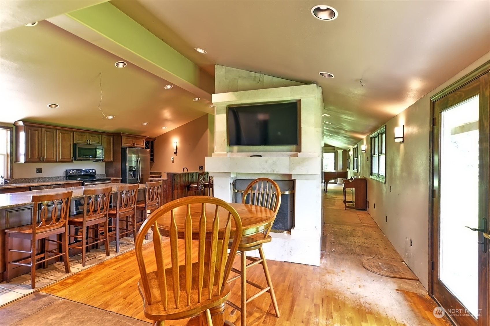 23720 Locust Way Bothell, WA 98021 - Photo 10 of 30 a view of a dining room kitchen with furniture and a kitchen