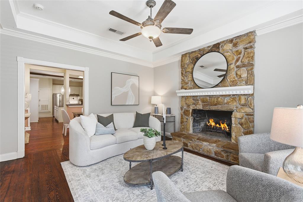 9121 6th Street Frisco, TX 75033 - Photo 4 of 27 a living room with furniture and a fireplace