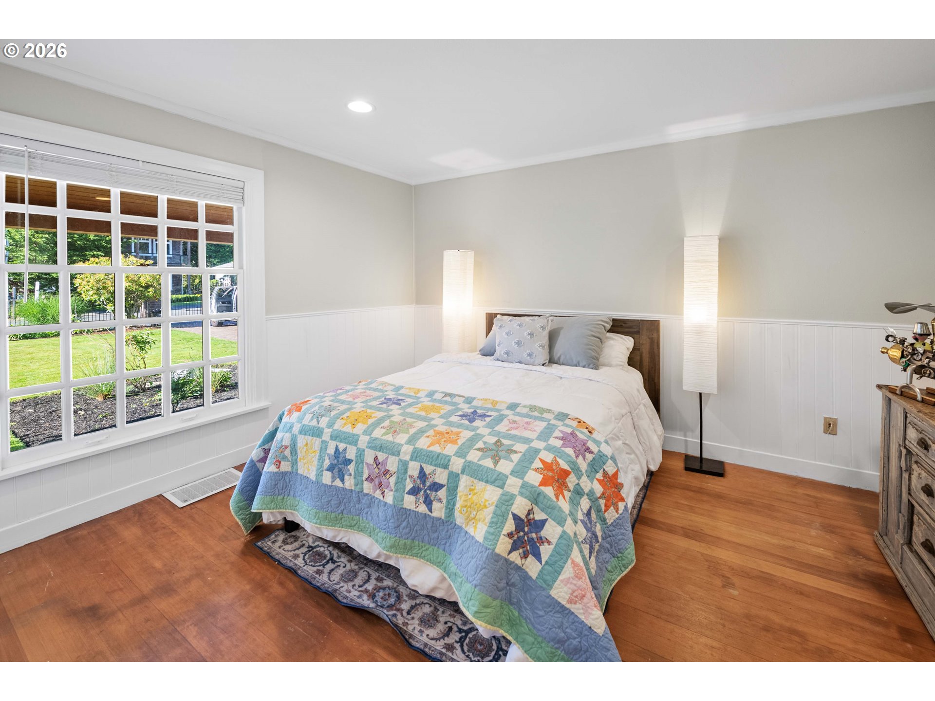 3232 Sunset Boulevard Seaside, OR 97138 - Photo 33 of 48 a bedroom with a bed window and wooden floor