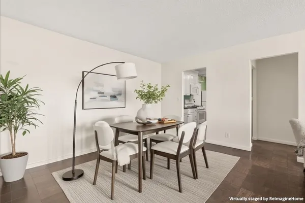 a dining room with furniture and window