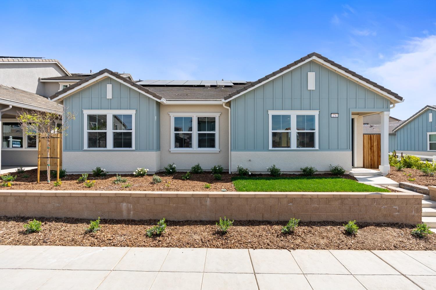 276 Huckleberry Lane South Madera, CA 93636 - Photo 1 of 32 a front view of a house with a yard