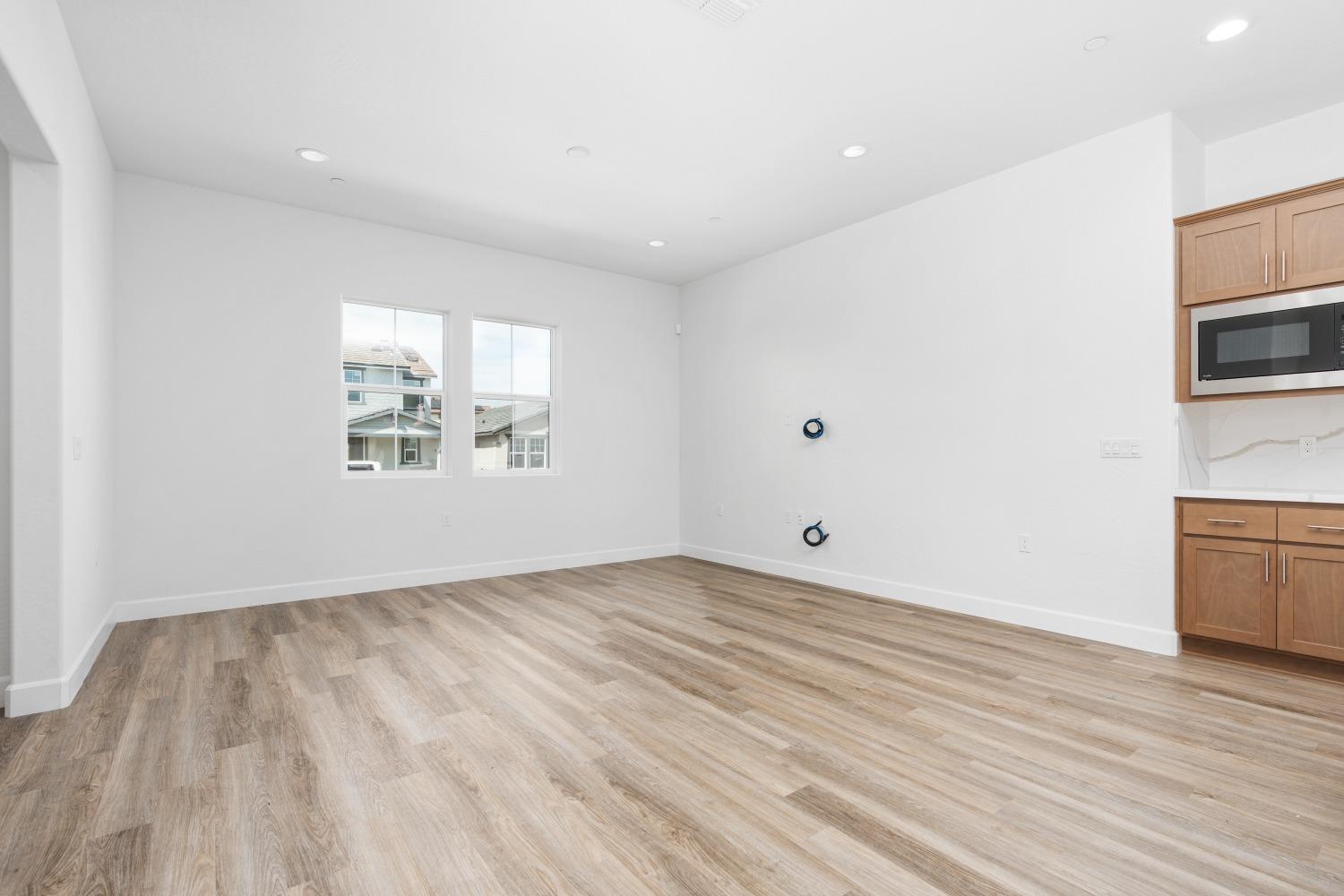 276 Huckleberry Lane South Madera, CA 93636 - Photo 11 of 32 a view of empty room with wooden floor and fan