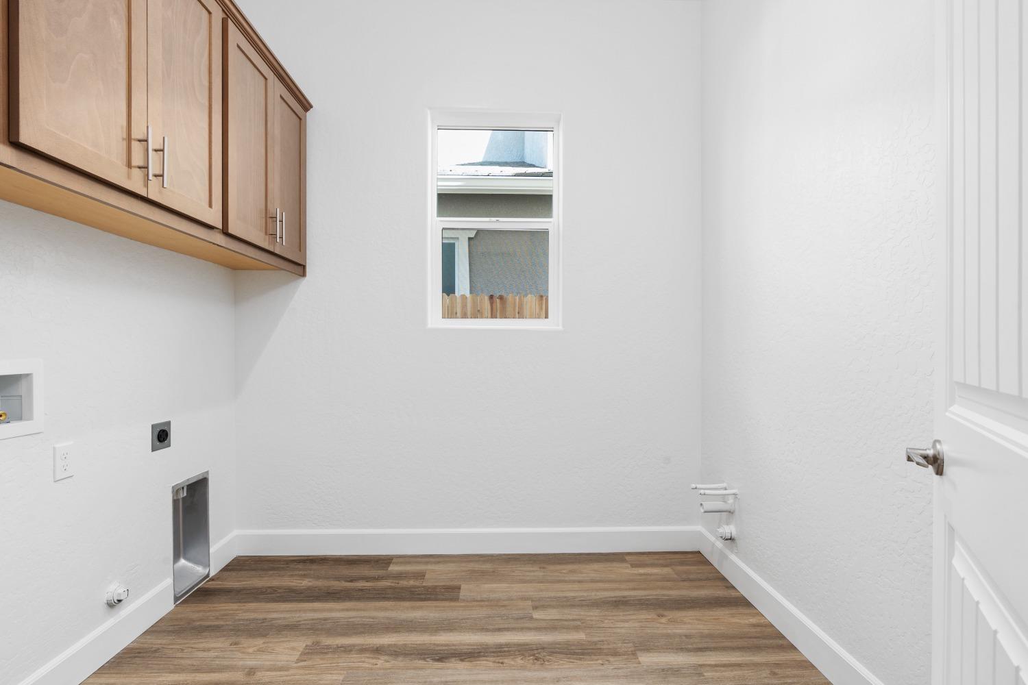 276 Huckleberry Lane South Madera, CA 93636 - Photo 18 of 32 a view of storage and utility room with wooden floor