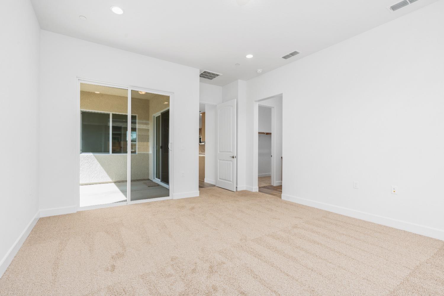 276 Huckleberry Lane South Madera, CA 93636 - Photo 19 of 32 a view of an empty room with glass door