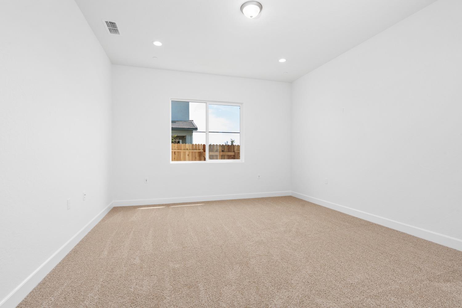 276 Huckleberry Lane South Madera, CA 93636 - Photo 20 of 32 an empty room with a window