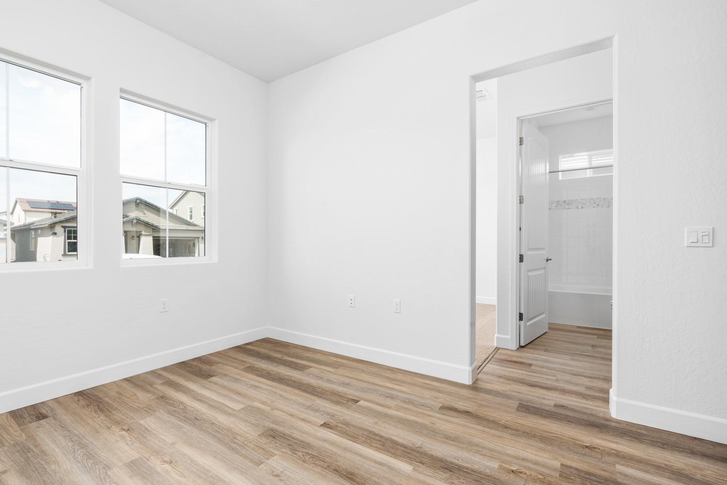 276 Huckleberry Lane South Madera, CA 93636 - Photo 21 of 32 a view of empty room with wooden floor and fan
