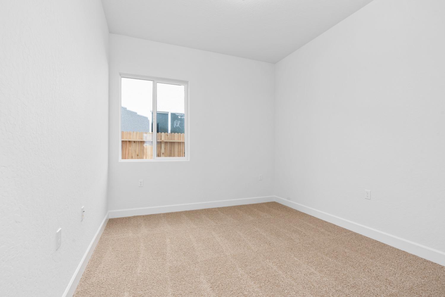 276 Huckleberry Lane South Madera, CA 93636 - Photo 24 of 32 an empty room with a window