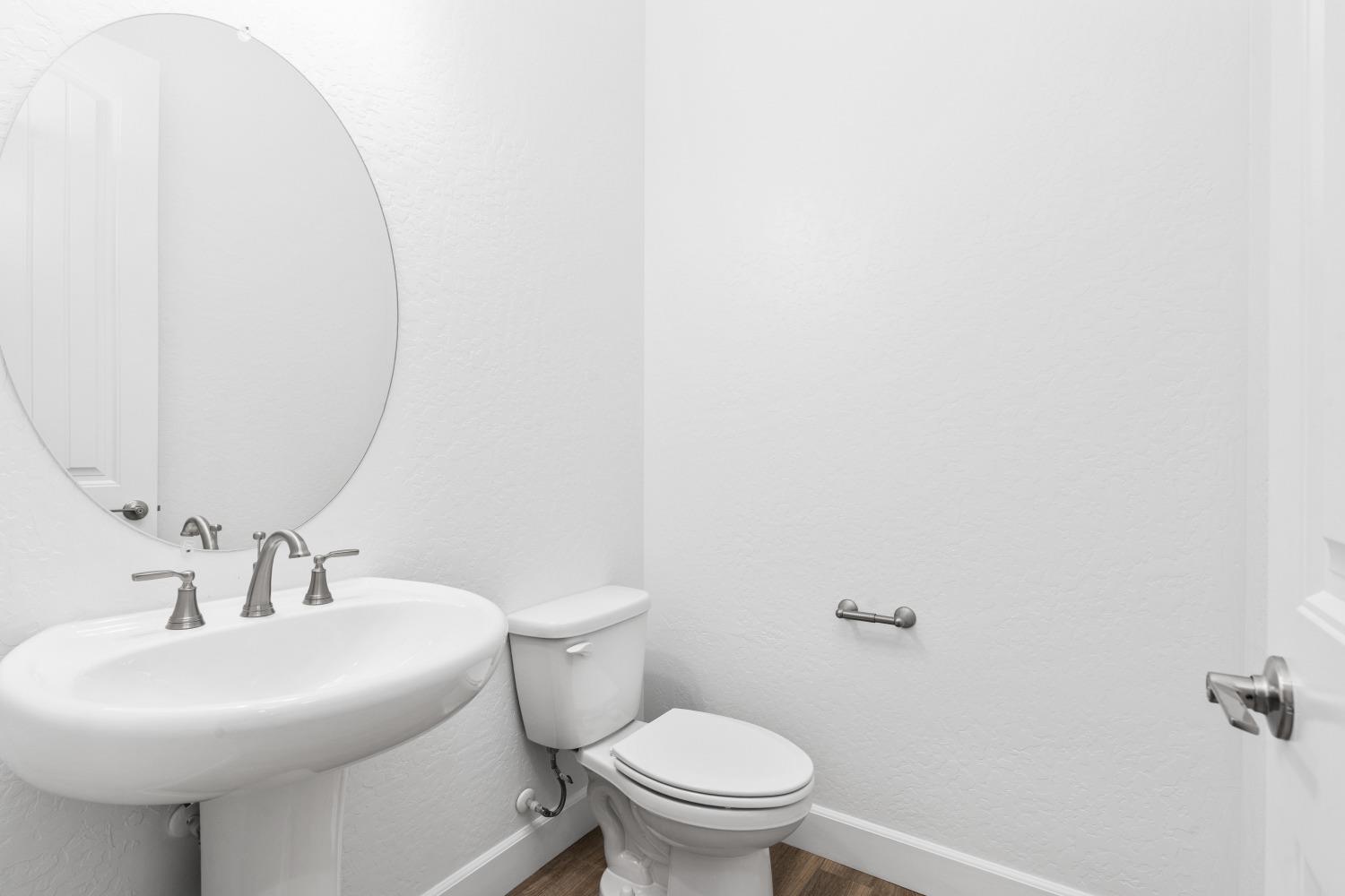 276 Huckleberry Lane South Madera, CA 93636 - Photo 29 of 32 a bathroom with a sink a toilet and mirror