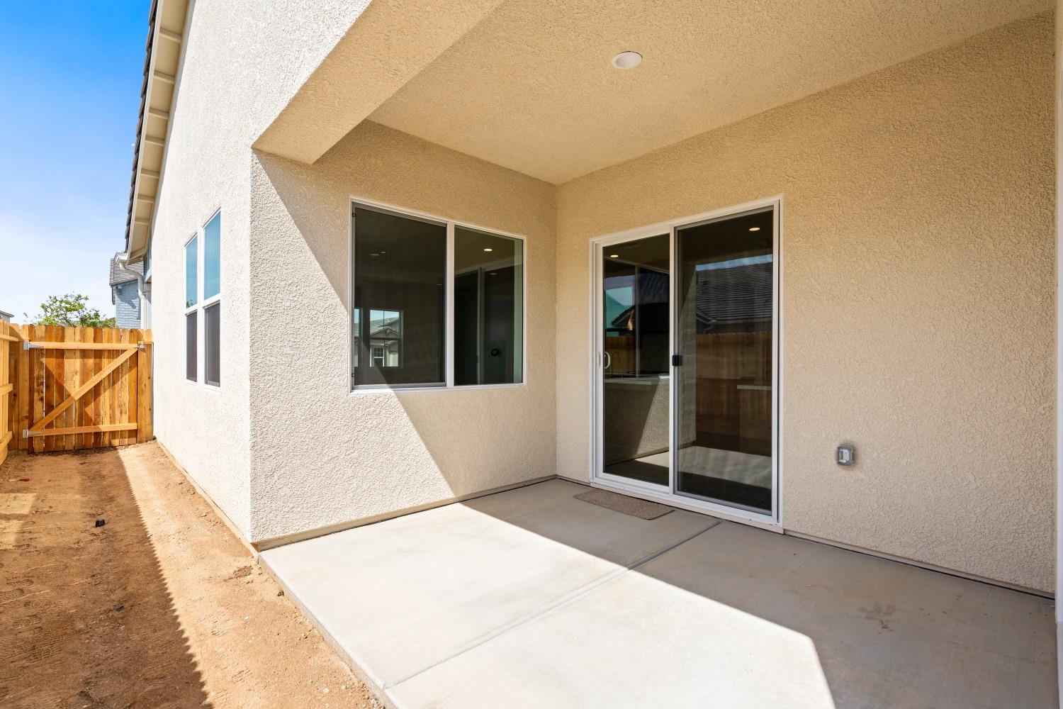 276 Huckleberry Lane South Madera, CA 93636 - Photo 31 of 32 a view of a white house with a large windows