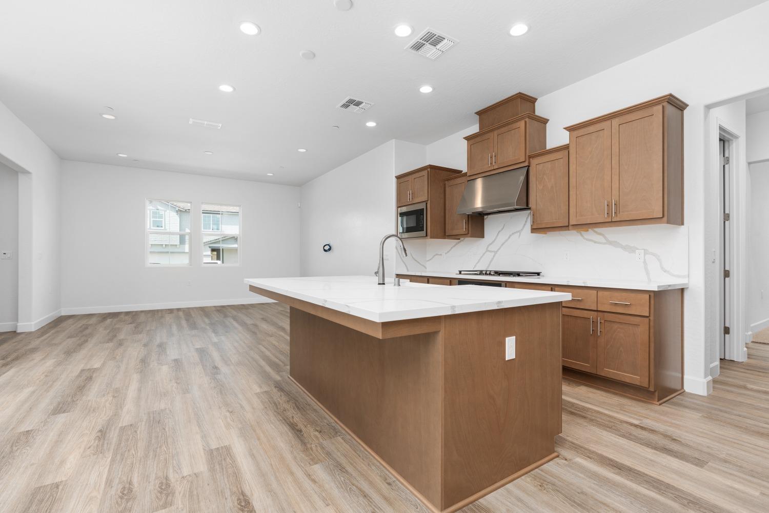 276 Huckleberry Lane South Madera, CA 93636 - Photo 10 of 32 a kitchen with stainless steel appliances granite countertop a sink and cabinets