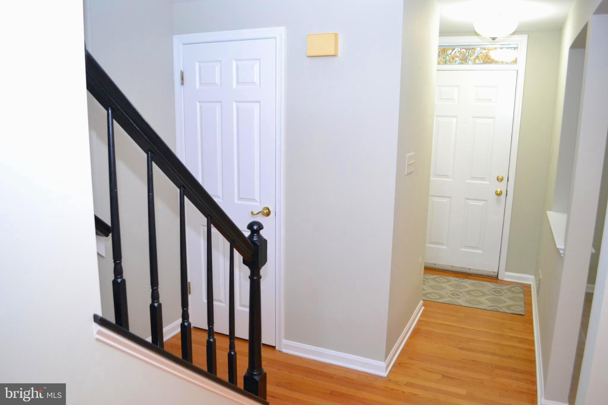 8019 Waterview Court Frederick, MD 21701 - Photo 3 of 56 Hallway to half bath , upstairs and kitchen
