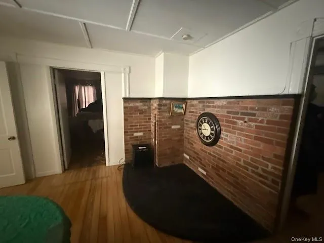 a view of hallway with wooden floor