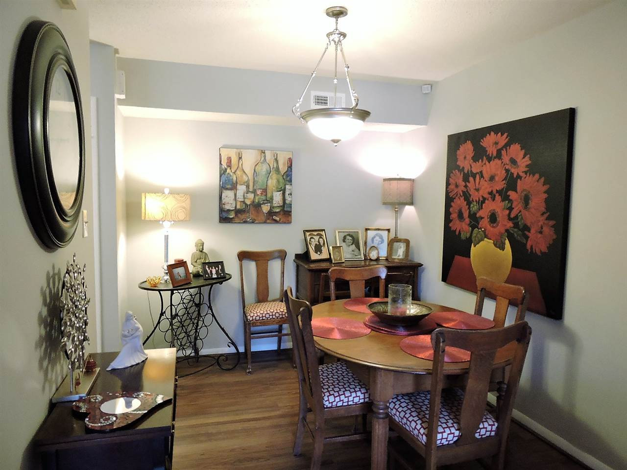 3702 Chimney Ridge Place, Unit 206 Durham, NC 27713 - Photo 11 of 19 a view of a dining room with furniture and chandelier