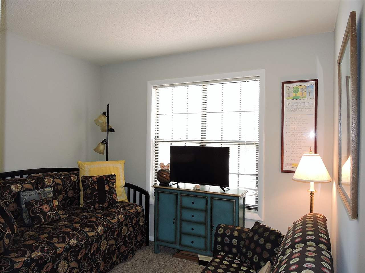 3702 Chimney Ridge Place, Unit 206 Durham, NC 27713 - Photo 14 of 19 a bedroom with a bed and flat screen tv