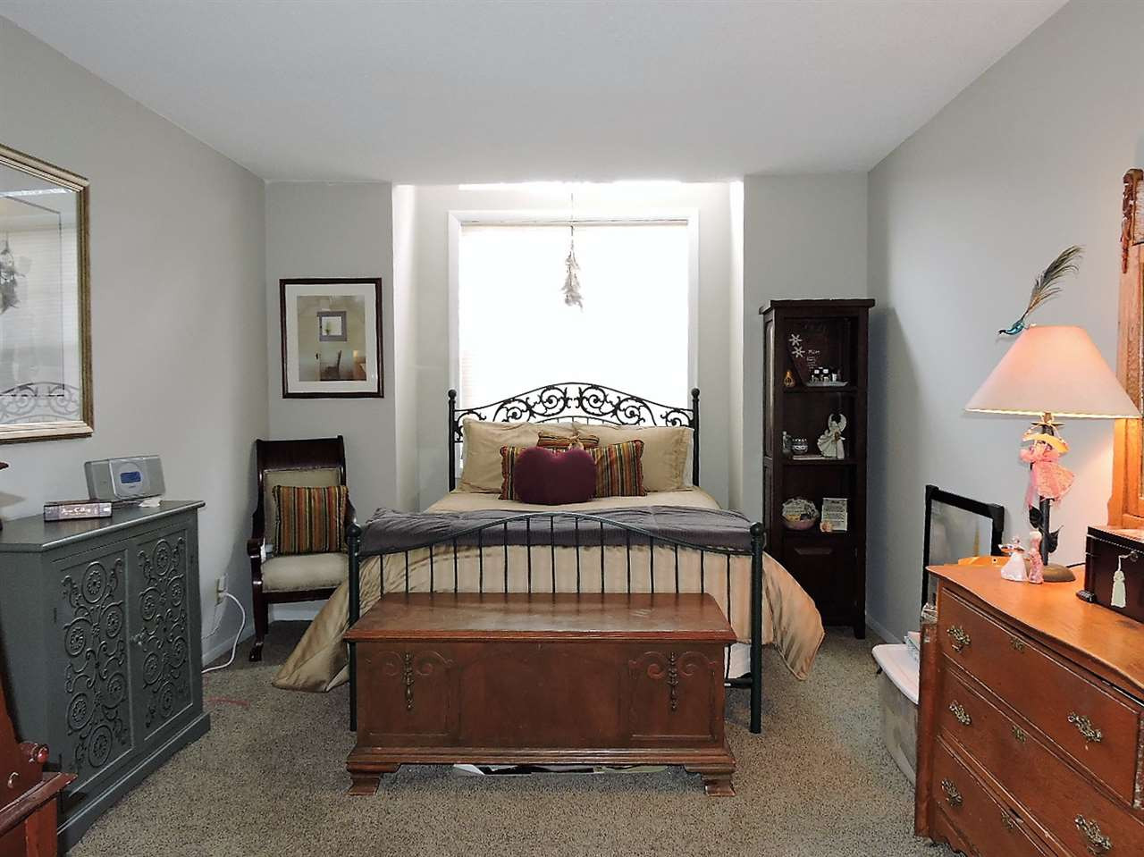 3702 Chimney Ridge Place, Unit 206 Durham, NC 27713 - Photo 15 of 19 a bedroom with furniture and a window