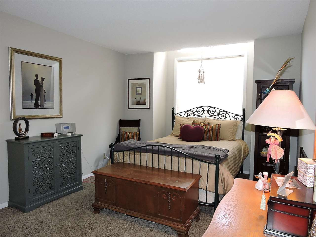 3702 Chimney Ridge Place, Unit 206 Durham, NC 27713 - Photo 16 of 19 a bedroom with furniture and a window