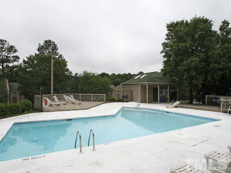 3702 Chimney Ridge Place, Unit 206 Durham, NC 27713 - Photo 19 of 19 a view of a swimming pool with lounge chair