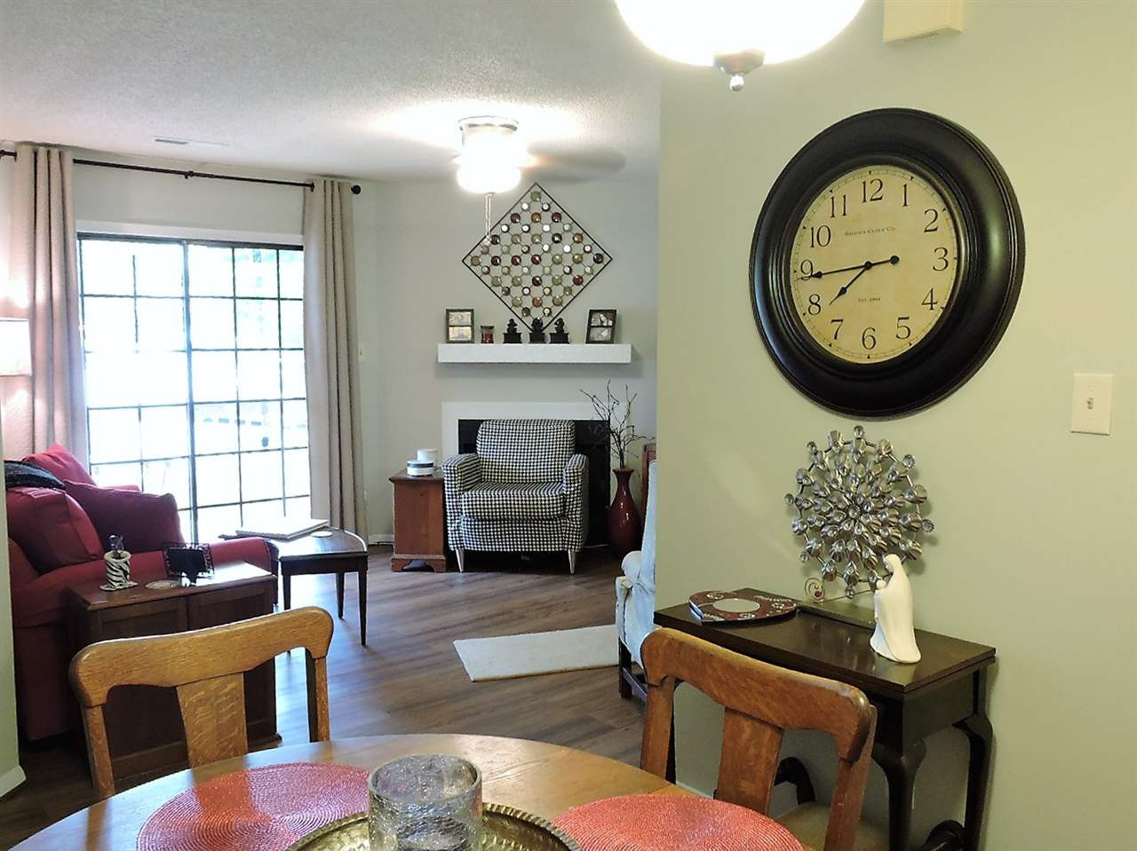 3702 Chimney Ridge Place, Unit 206 Durham, NC 27713 - Photo 10 of 19 a living room with furniture a window and a potted plant
