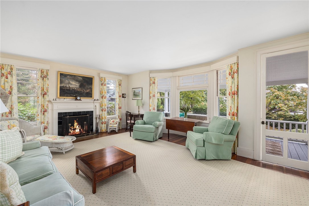 34 Emerson Road Jamestown, RI 02835 - Photo 14 of 45 The living room is 17'8" x 20'3", with access to the porch as well!