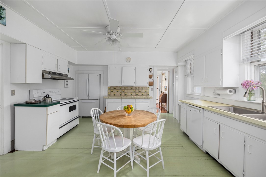 34 Emerson Road Jamestown, RI 02835 - Photo 20 of 45 The spacious eat-in-kitchen is 14'3" x 17'7".