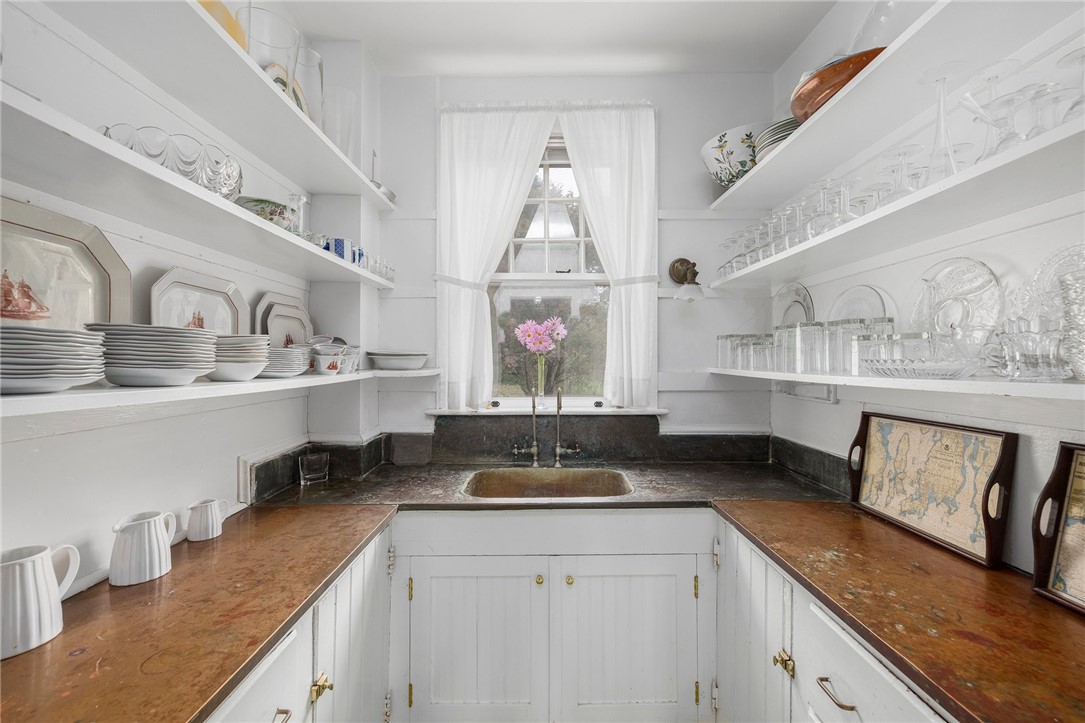 34 Emerson Road Jamestown, RI 02835 - Photo 26 of 45 This butler's pantry is a true architectural gem, with its copper sink and beautiful counters, this space is 6'1" x 11'1".
