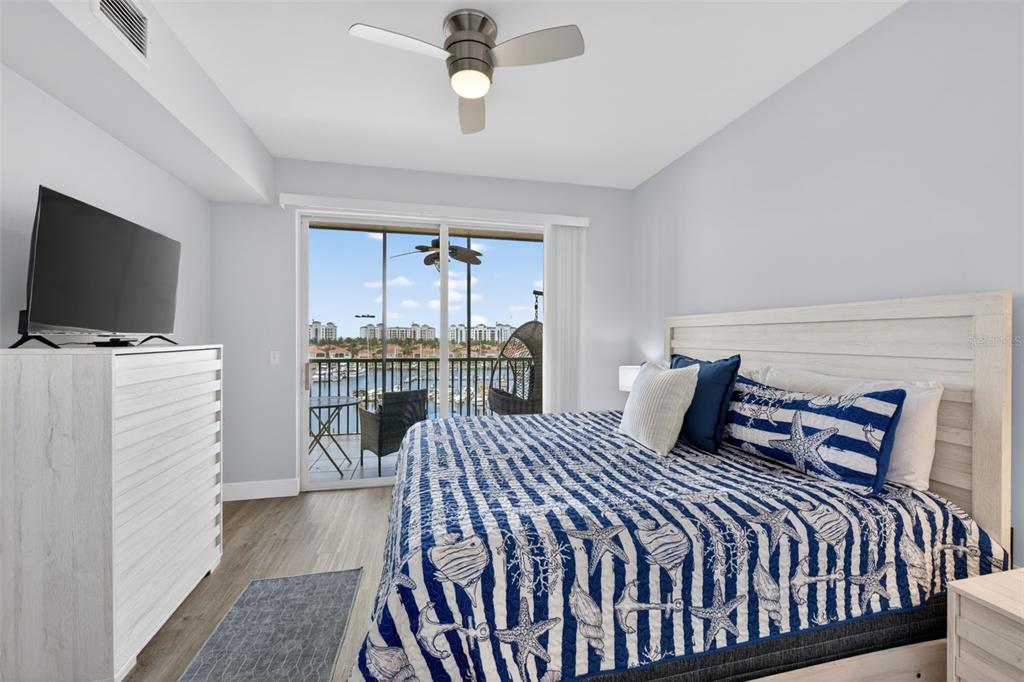 2090 Matecumbe Key Road, Unit 1603 Punta Gorda, FL 33955 - Photo 18 of 47 a bedroom with a bed and a flat tv screen on wall