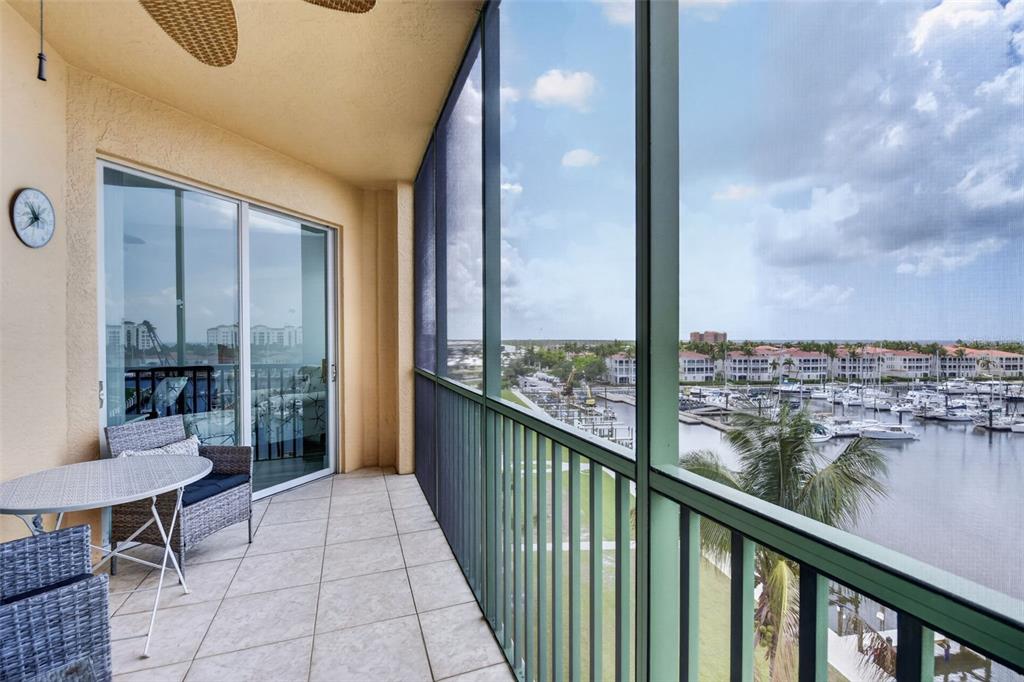 2090 Matecumbe Key Road, Unit 1603 Punta Gorda, FL 33955 - Photo 22 of 47 a view of a balcony with chair and table in the balcony
