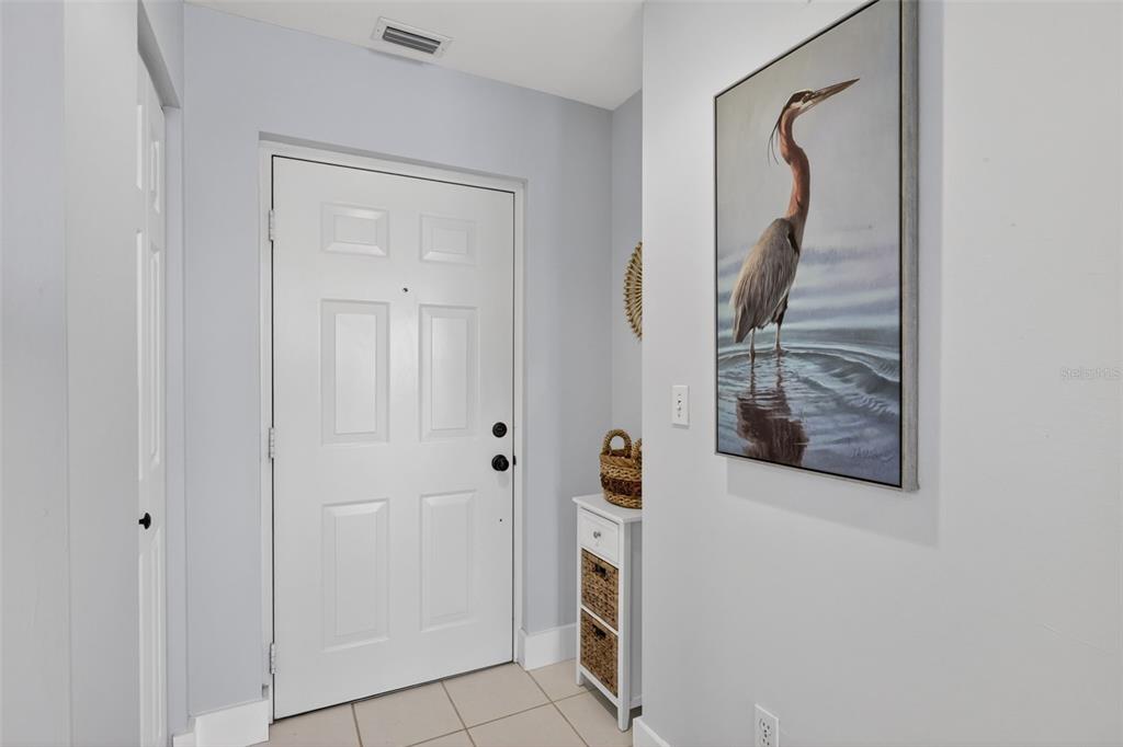 2090 Matecumbe Key Road, Unit 1603 Punta Gorda, FL 33955 - Photo 27 of 47 a view of a bathroom from a hallway