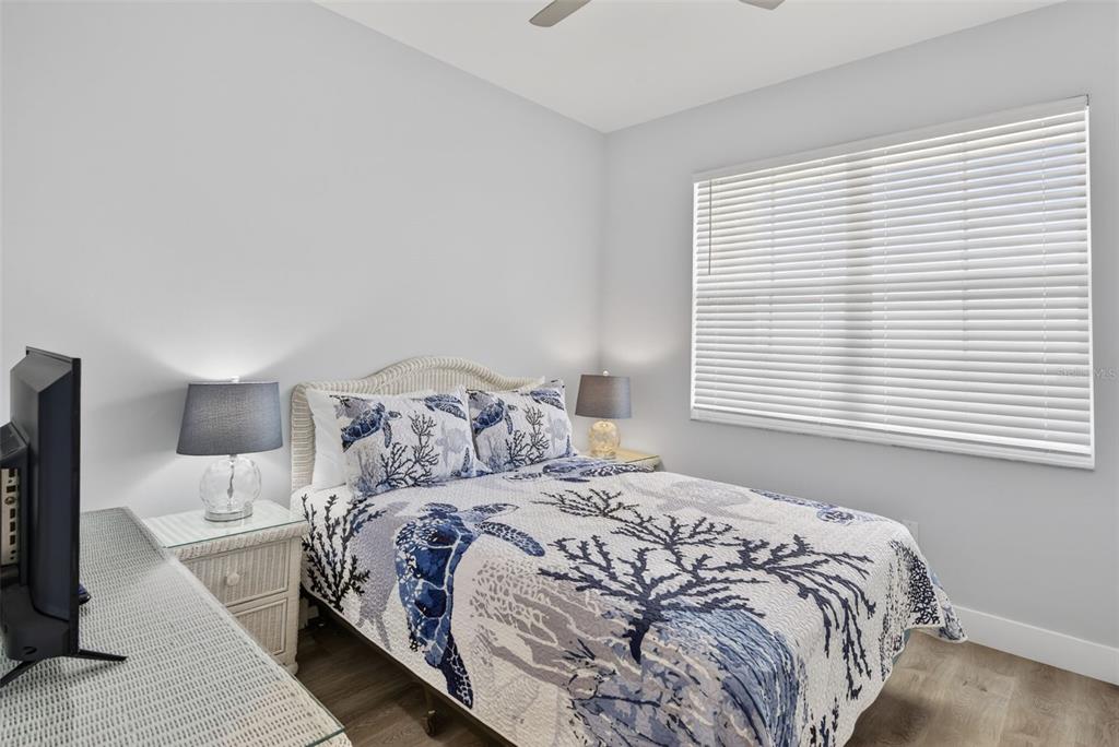 2090 Matecumbe Key Road, Unit 1603 Punta Gorda, FL 33955 - Photo 28 of 47 a large bed sitting in a bedroom next to a window