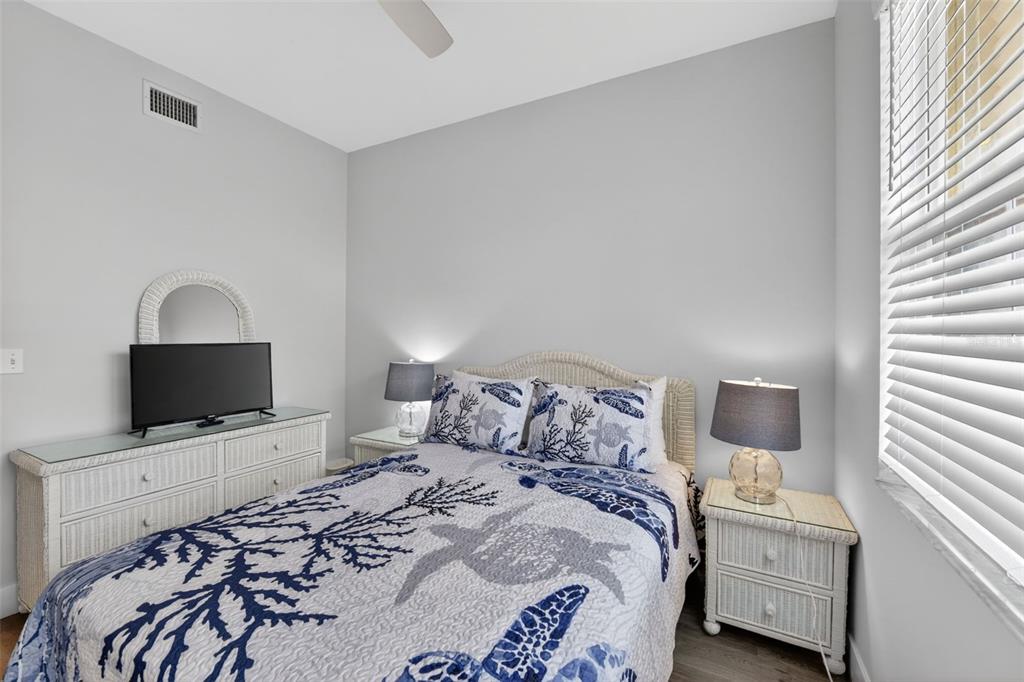 2090 Matecumbe Key Road, Unit 1603 Punta Gorda, FL 33955 - Photo 33 of 47 a bedroom with a bed and a flat screen tv