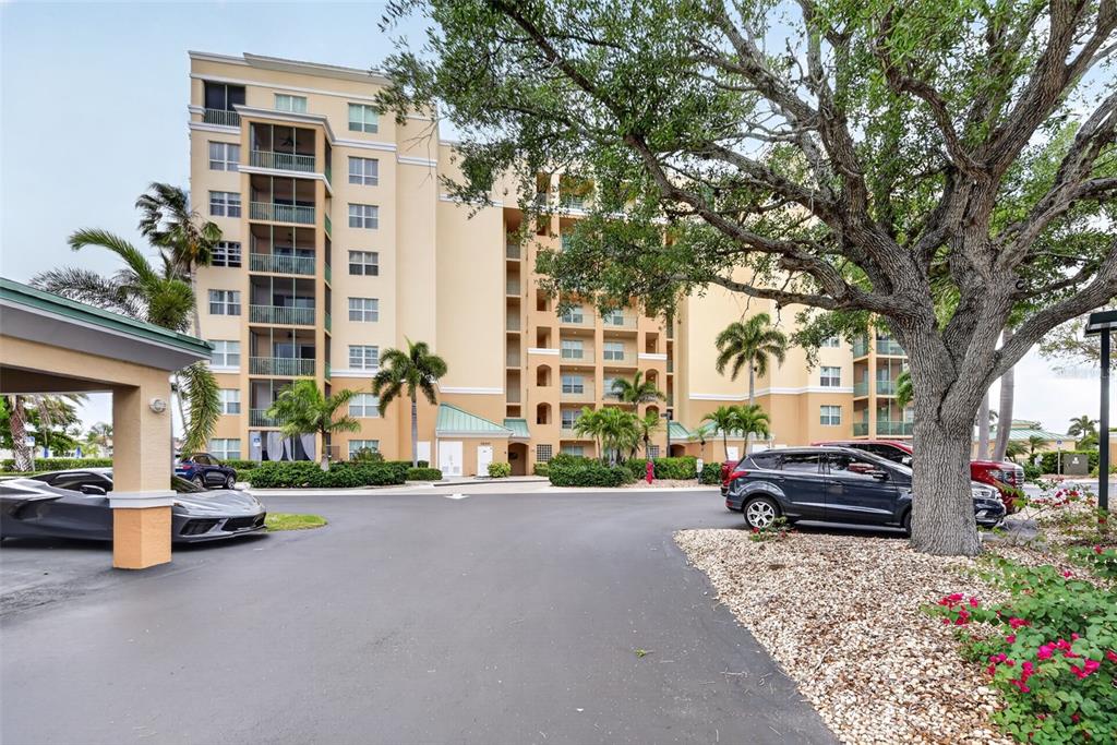 2090 Matecumbe Key Road, Unit 1603 Punta Gorda, FL 33955 - Photo 34 of 47 a parked cars parked in front of a building