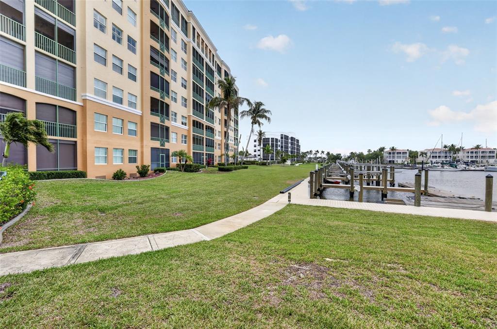 2090 Matecumbe Key Road, Unit 1603 Punta Gorda, FL 33955 - Photo 40 of 47 a view of building with garden and tall trees