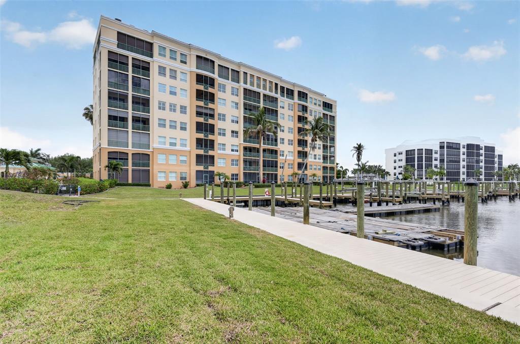 2090 Matecumbe Key Road, Unit 1603 Punta Gorda, FL 33955 - Photo 41 of 47 a large building with a yard