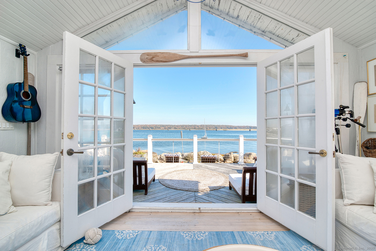 Porch and French doors water view. Stunning waterfront views overlooking Bluff Point and Fishers Island