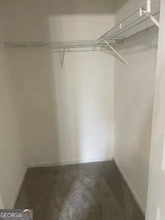 a view of an empty walk in closet