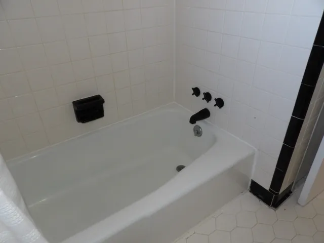 a view of hallway with wooden floor