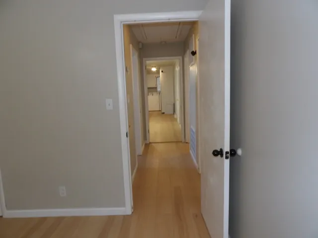 a kitchen with stainless steel appliances granite countertop a sink a stove a refrigerator and cabinets