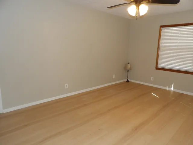 a kitchen with a refrigerator stove and white cabinets