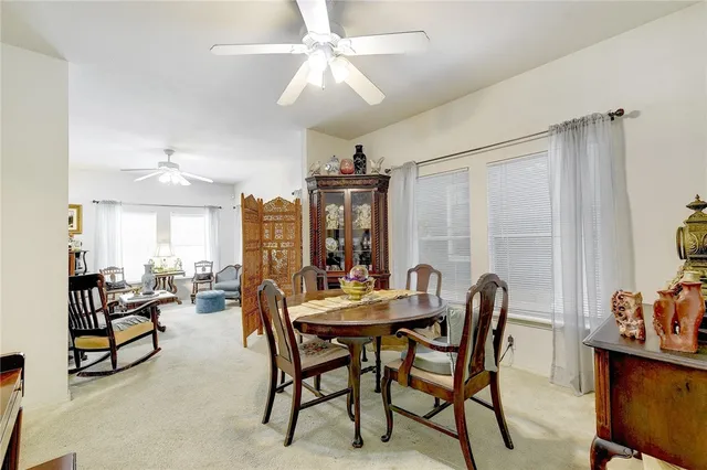 a dining room with furniture and window