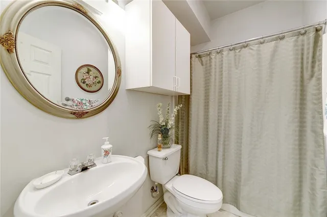 a bathroom with a toilet and a sink
