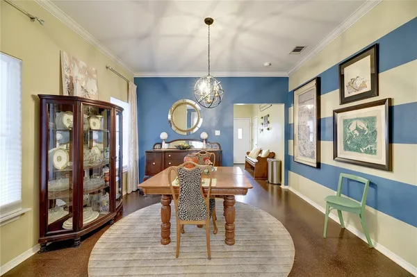 a living room with furniture a window and wooden floor